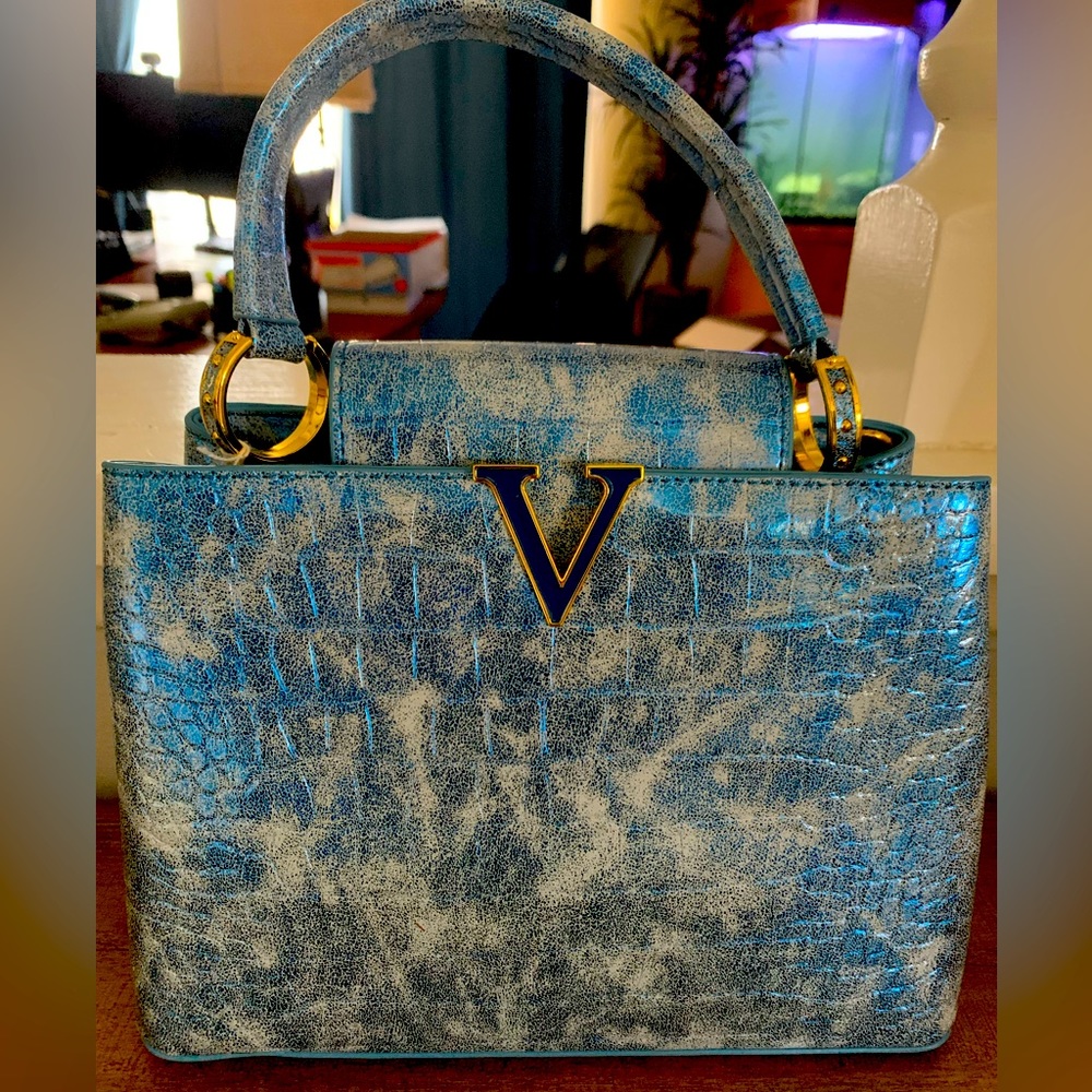Blue and gold shoulder bag.